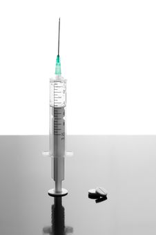 Syringe And Tablets Royalty Free Stock Image