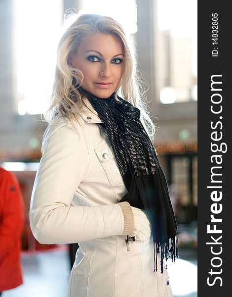 Young blond woman at a station in backlight. Young blond woman at a station in backlight