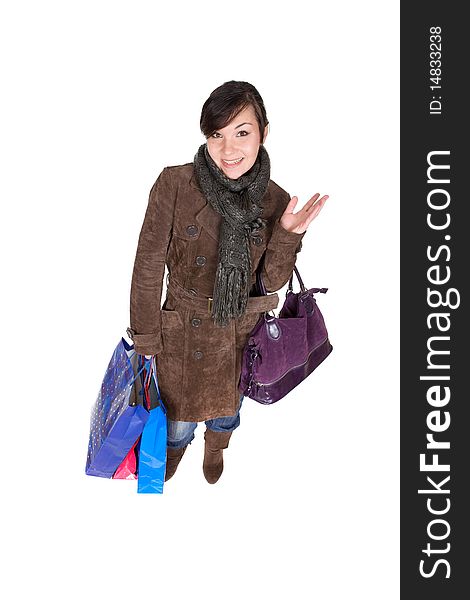 Young adult brunette woman with shopping bags