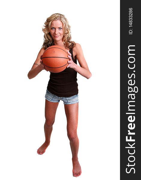 Attractive female basketball player with a white background. Attractive female basketball player with a white background