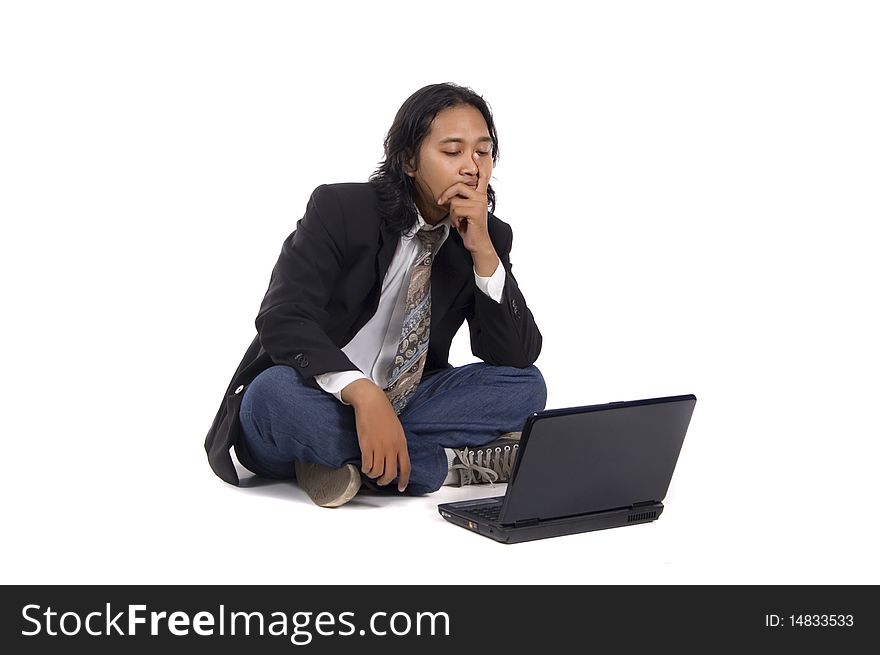 Long hair man sit on the floor, frustated working with laptop, isolated on white. Long hair man sit on the floor, frustated working with laptop, isolated on white