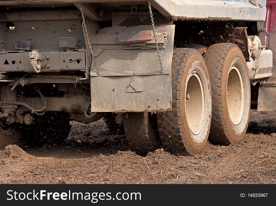Heavy truck driving through the mud. Heavy truck driving through the mud.