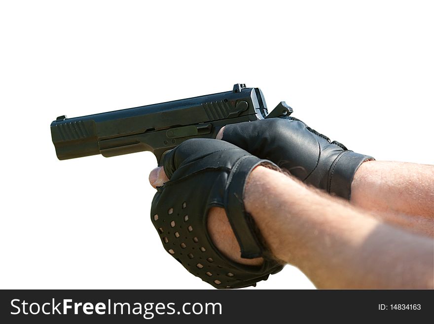 Pistol in the man's hands, ready to fire (isolated). Pistol in the man's hands, ready to fire (isolated).