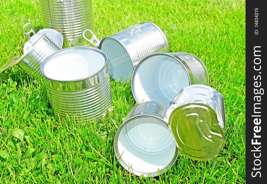 Tins in grass - recycling concept. Tins in grass - recycling concept