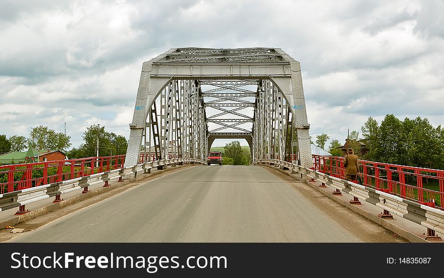 The metal road bridge over the river in the Perm province, Kungur city