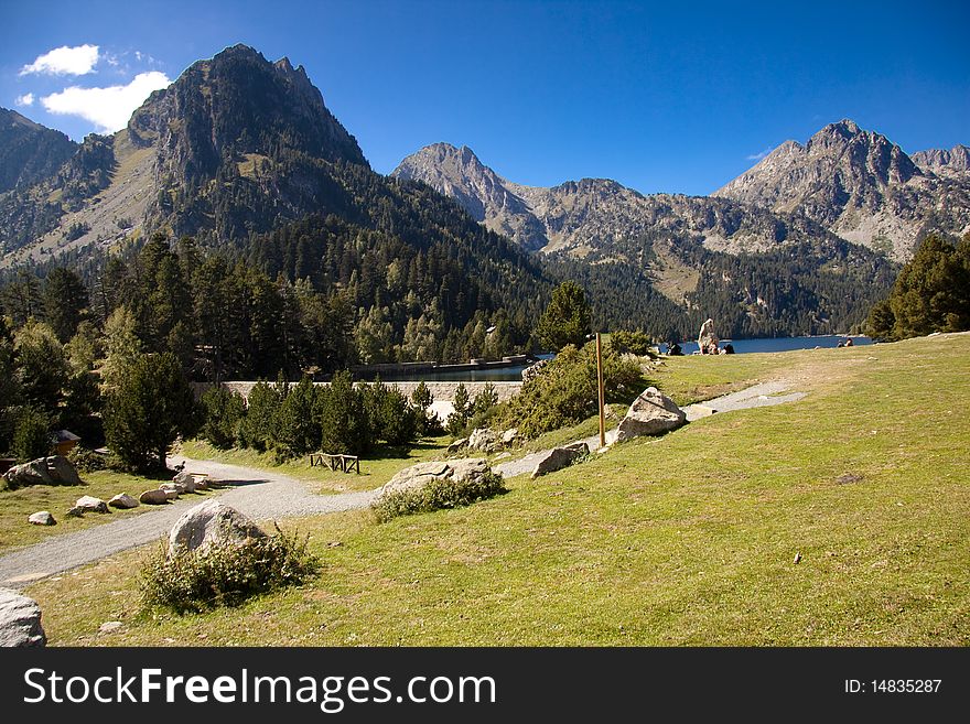 Summer day in Pyrenees. Sant Maurici lakeBeauty view. Summer day in Pyrenees. Sant Maurici lakeBeauty view