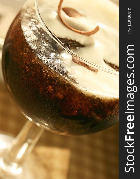 Ice coffee cocktail with cream and chocolate shavings. Ice coffee cocktail with cream and chocolate shavings