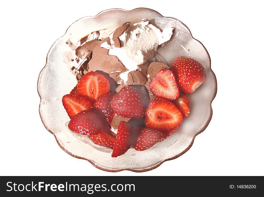 Pieces of strawberry with ice cream in a glass vase