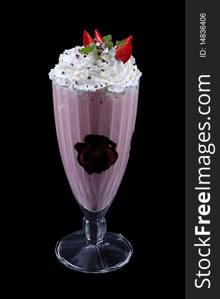 Strawberry shake in wineglass on white