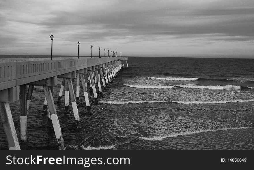 A long pier on the Atlantic Ocean at North Carolina, USA. A long pier on the Atlantic Ocean at North Carolina, USA.