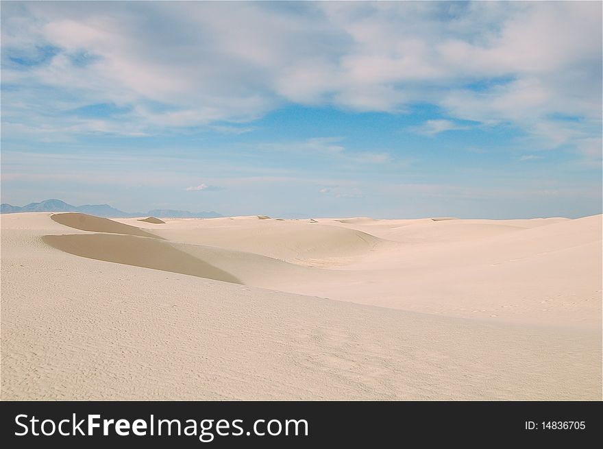 White sand dunes and blue sky in white sands national park, new mexico. White sand dunes and blue sky in white sands national park, new mexico