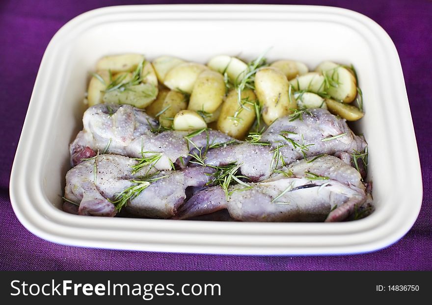 Raw Quail With Potatoes And Rosemary