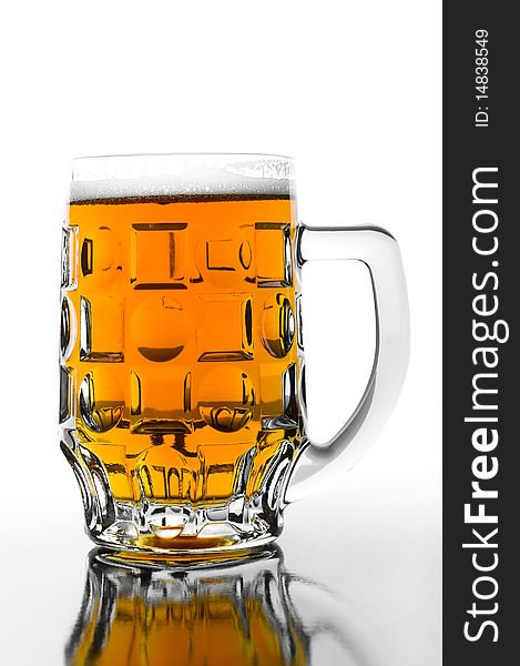 Cold beer in glass on glossy background. Cold beer in glass on glossy background