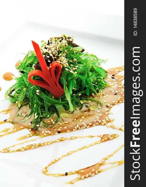 Pickled Seaweed with Nut Sauce. Garnished with Sesame Seeds and Red Pepper. Pickled Seaweed with Nut Sauce. Garnished with Sesame Seeds and Red Pepper