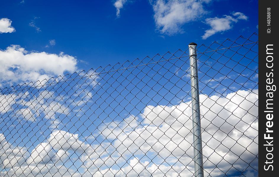 Suggestive image of metal fence against the sky. Suggestive image of metal fence against the sky