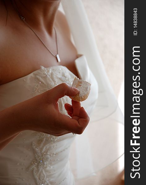 Bride eating a sweet cake