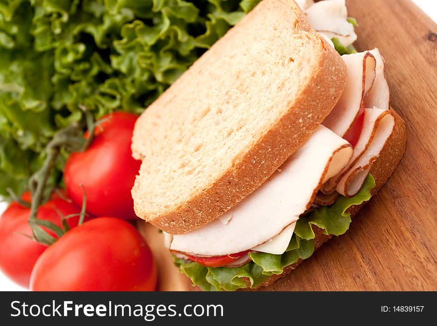 Delicious turkey breast sandwich, lettuce and vine ripe tomatoes