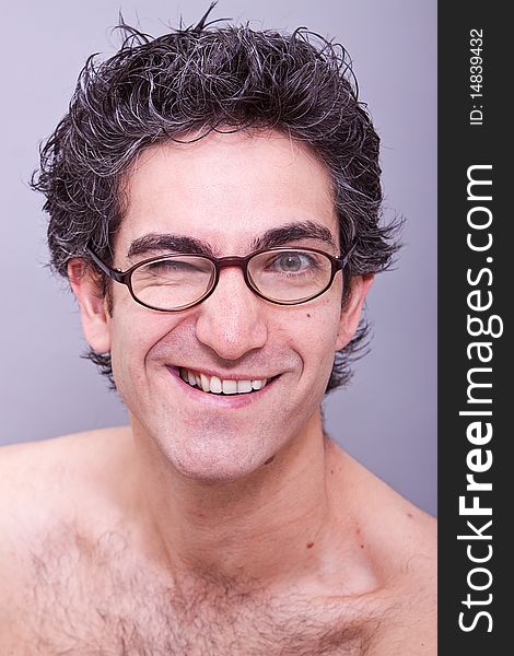 Goofy looking young man in eyeglasses