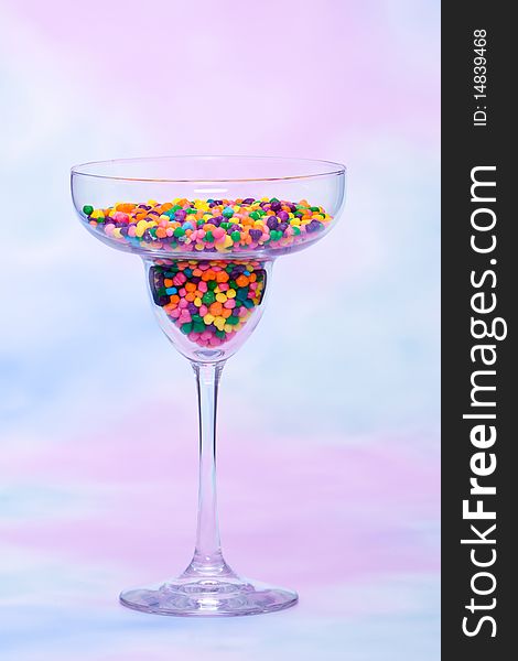 Margarita glass filled with colorful candy. Margarita glass filled with colorful candy