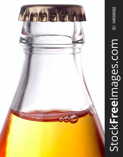 Glass bottle with a cover close up, on a white background