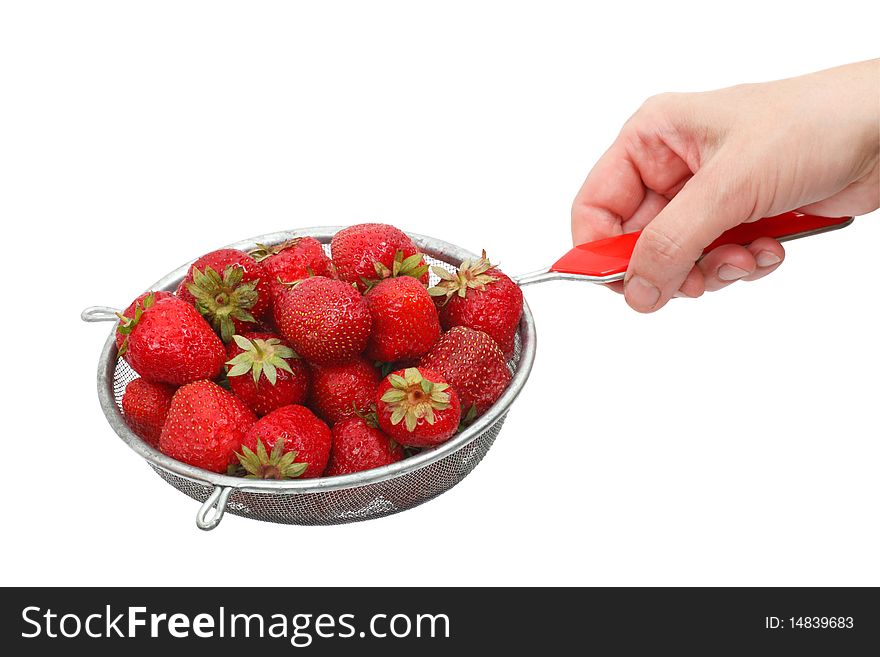 Fresh strawberries in a colander.  Isolated object on a white background