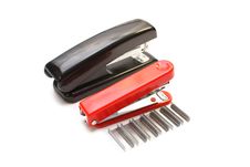 Isolated Black Stapler And Red Stapler Royalty Free Stock Photos
