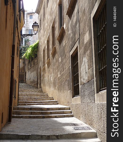 Little alley with concrete stairs