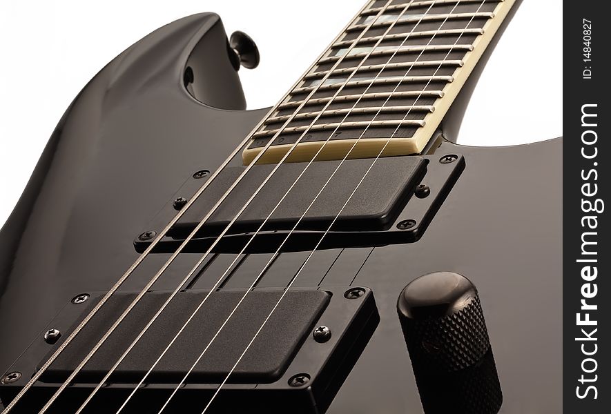 Black electro-guitar close-up isolated on white