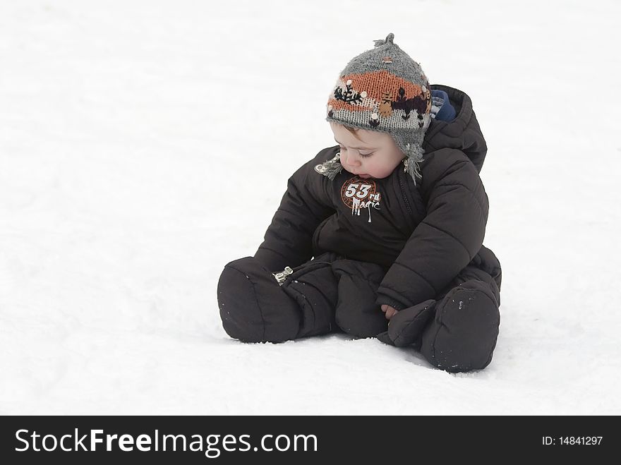A small child in the cold white snow