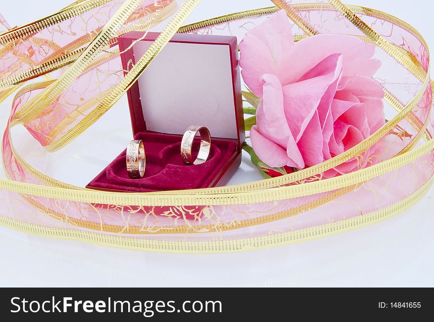 Rose and wedding rings. You can you it for wedding card