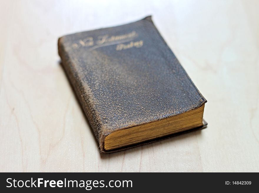 Stack of dusty worn books on poetry and and a bible