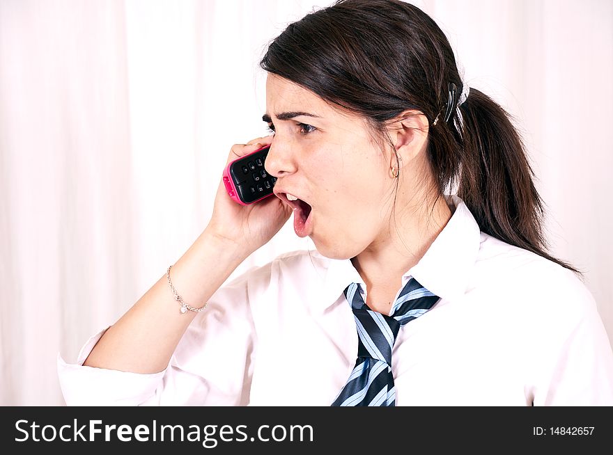 Female office worker having telephone conversation with client or customer