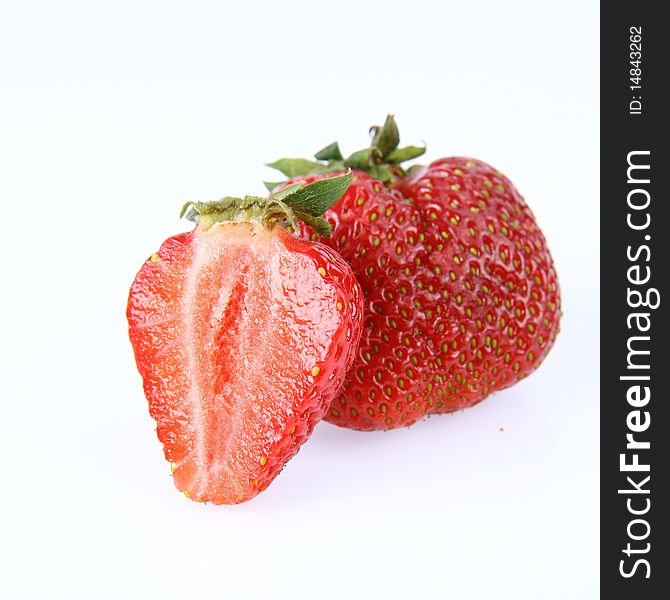 Strawberries on white background (a whole one and a half)