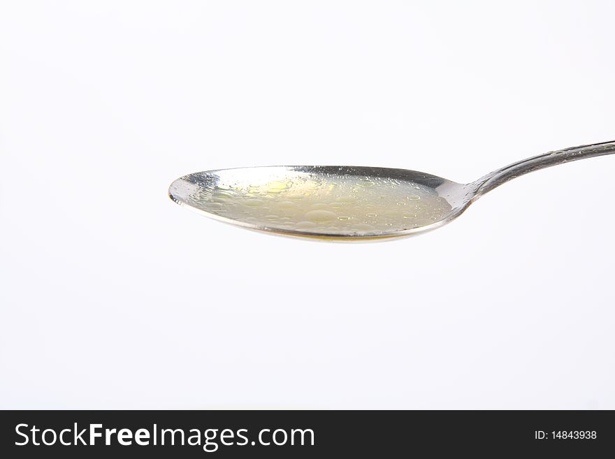 Chicken soup on a spoon