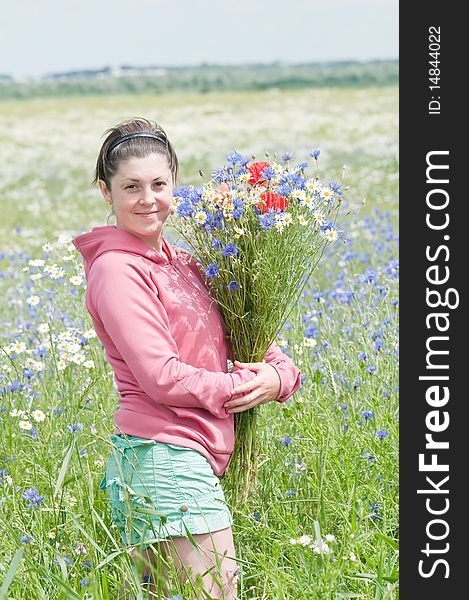 Girl collect flower on meadow