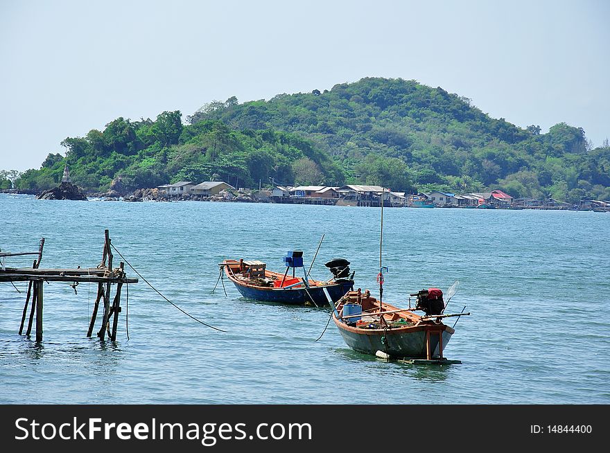 Two boats and fishery village at the south of Thailand. Two boats and fishery village at the south of Thailand