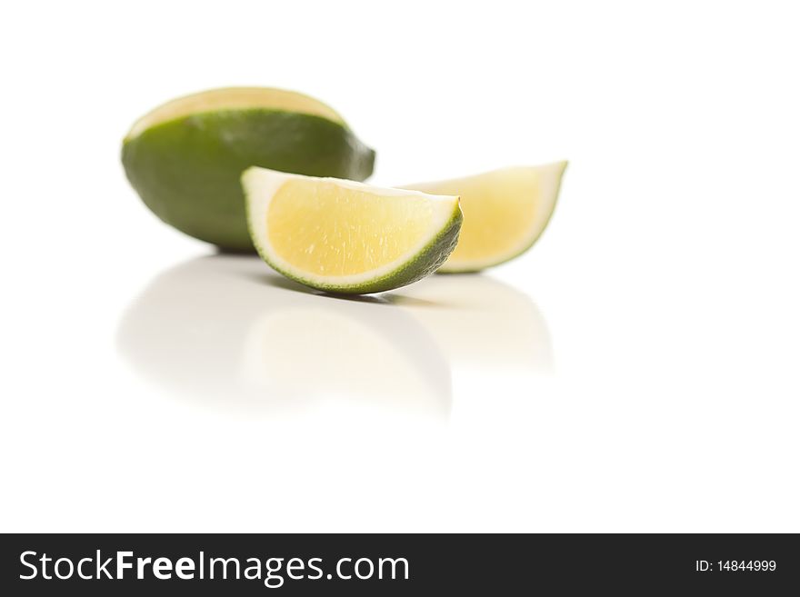 Sliced Lime On Reflective White Surface