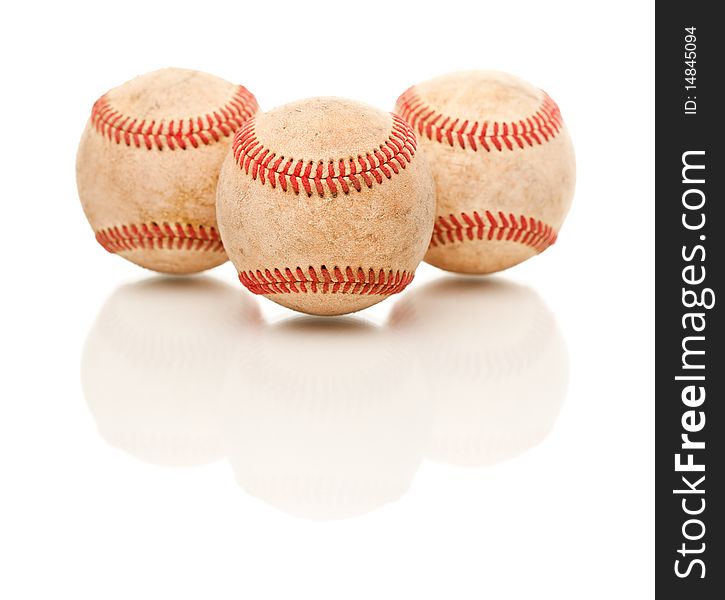 Three Baseballs Isolated On Reflective White