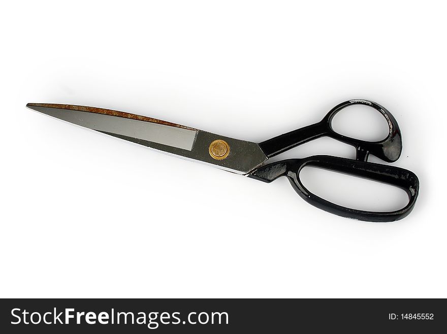 Pair of scissors over white background