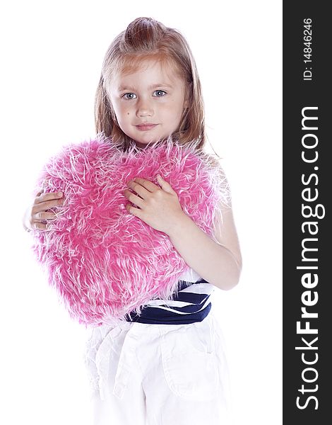 Beautiful baby with heart pink pillow on white background