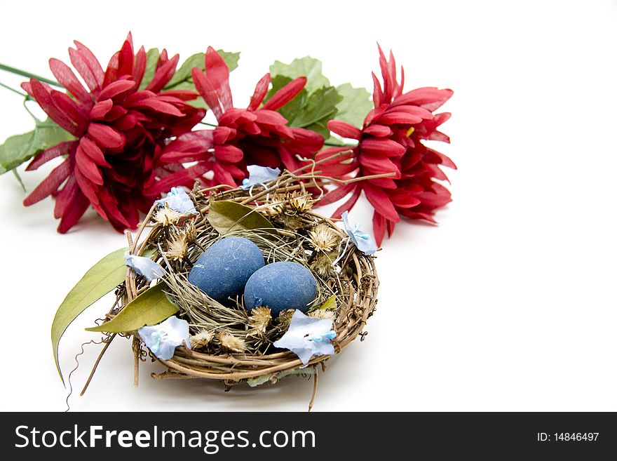 Blue easter-eggs with red flower blossoms. Blue easter-eggs with red flower blossoms