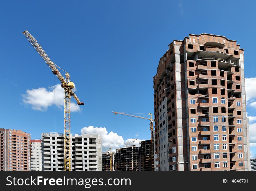 Building site with residential houses under construction. Building site with residential houses under construction