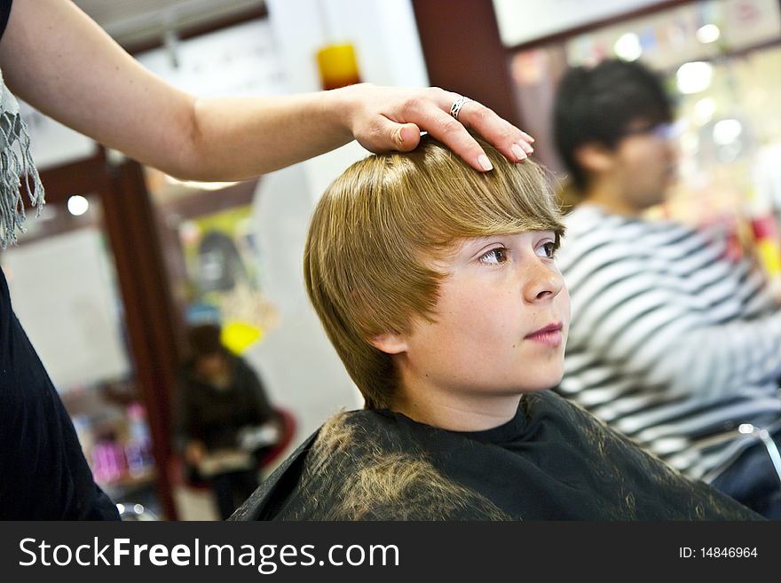 Young Boy  At The Hairdresser