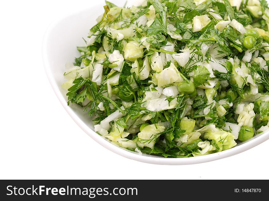 Fresh salad from vegetables and greens on a plate