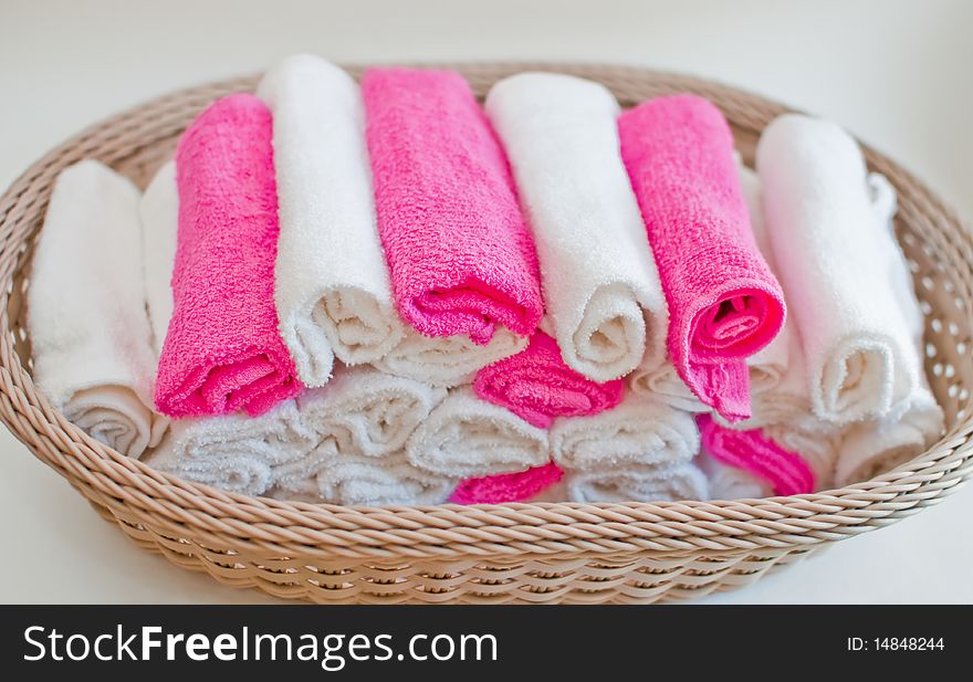 Towels rolled inside a handicraft basket. Towels rolled inside a handicraft basket