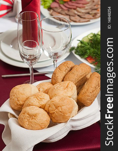 Small rolls of bread on a celebratory table. Small rolls of bread on a celebratory table.