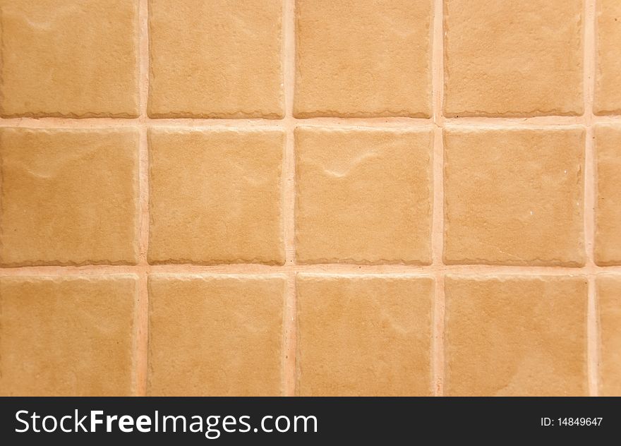 Yellow tiled wall of marble as background abstract texture