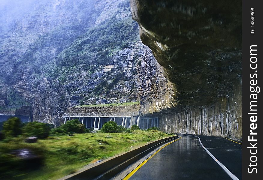 The open tunnel carved into the mountain at Chapman's Peak Drive, South Africa. The open tunnel carved into the mountain at Chapman's Peak Drive, South Africa