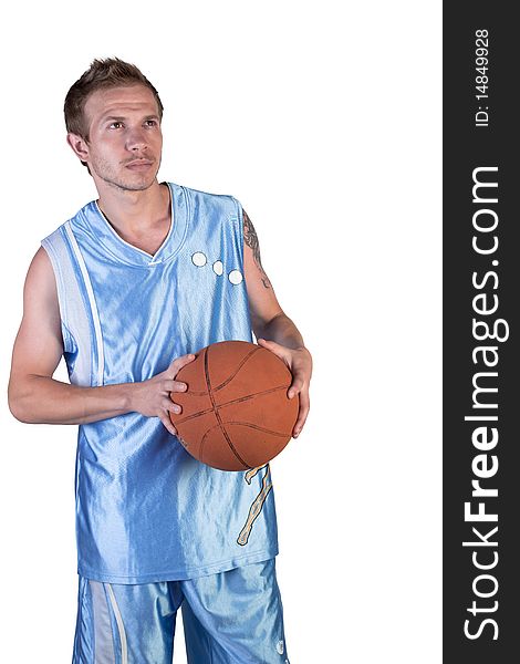 Basketball player posing with ball in hand on a white background. Basketball player posing with ball in hand on a white background