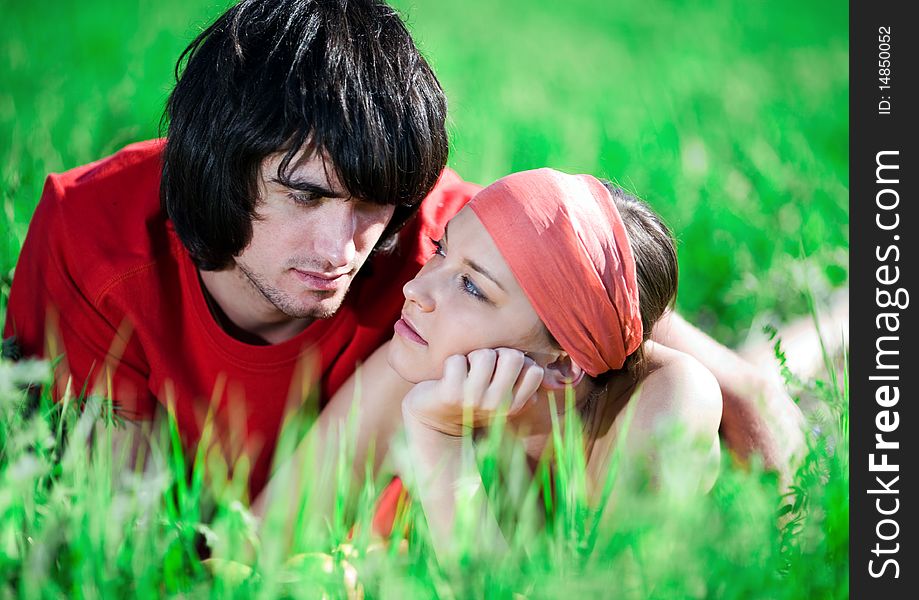 Boy And Nice Girl On Grass